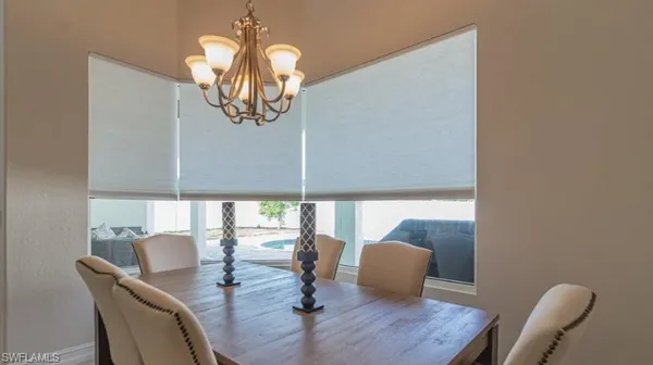 a dining room with furniture and wooden floor