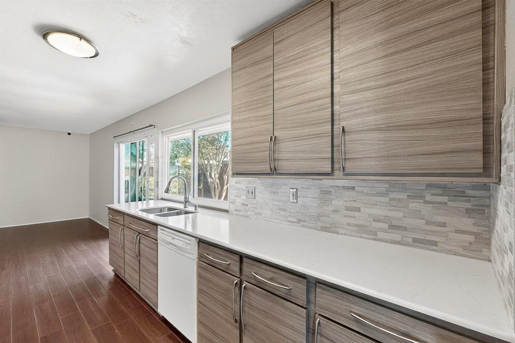 913 Overdowns Drive Plano, TX 75023 - Photo 11 of 35 a kitchen with a sink and a window