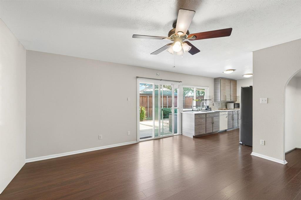 913 Overdowns Drive Plano, TX 75023 - Photo 17 of 35 a view of a living room hardwood floor and a ceiling fan