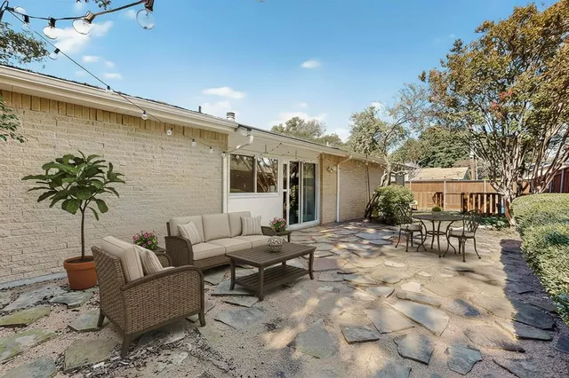 a view of a house with a snow in the background