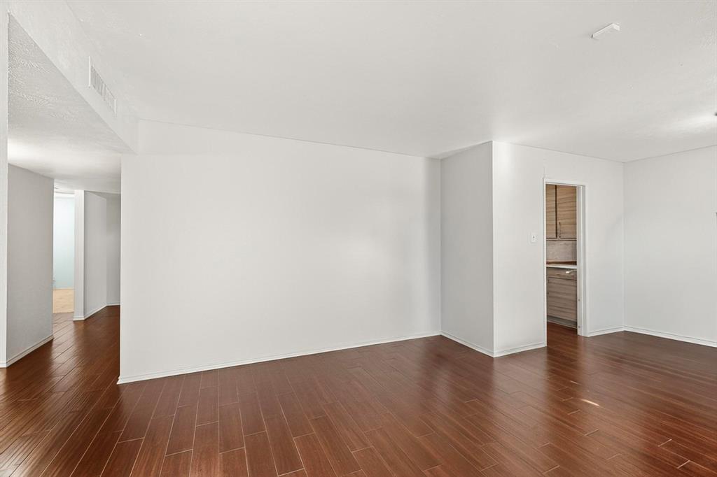 913 Overdowns Drive Plano, TX 75023 - Photo 8 of 35 a view of an empty room with wooden floor