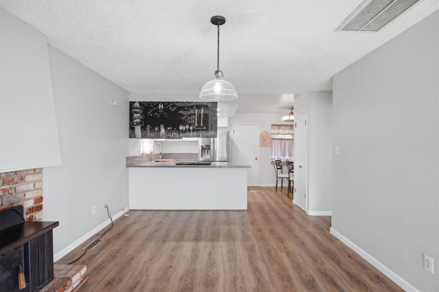 1436 Montclair Drive Modesto, CA 95350 - Photo 11 of 29 a view of a room with wooden floor and a window