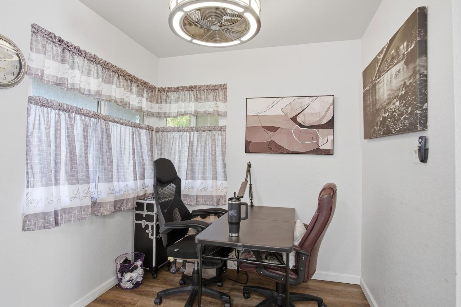 1436 Montclair Drive Modesto, CA 95350 - Photo 11 of 24 a view of a workspace with furniture and a window
