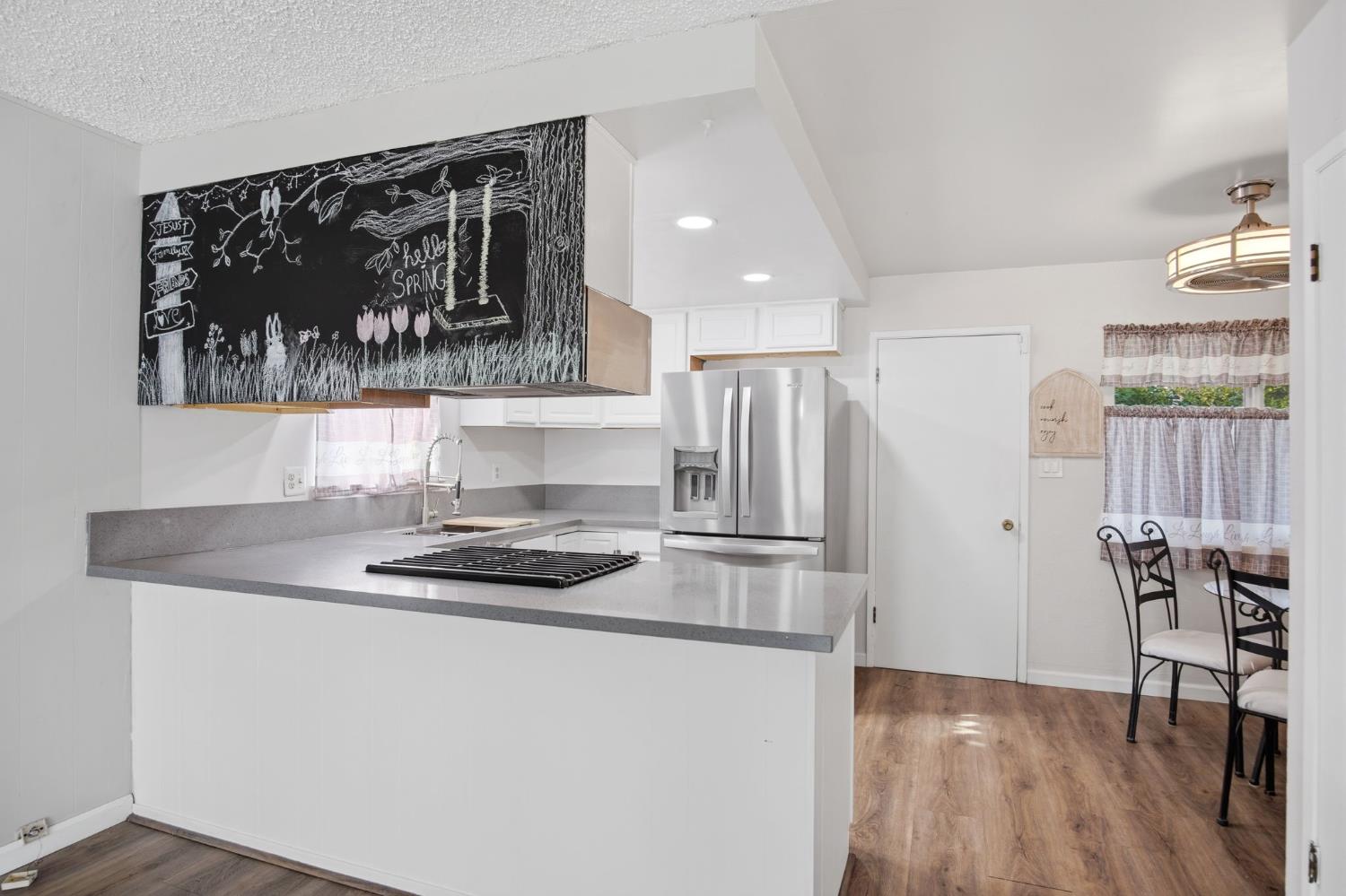 1436 Montclair Drive Modesto, CA 95350 - Photo 14 of 29 a kitchen with stainless steel appliances granite countertop a refrigerator and a stove top oven