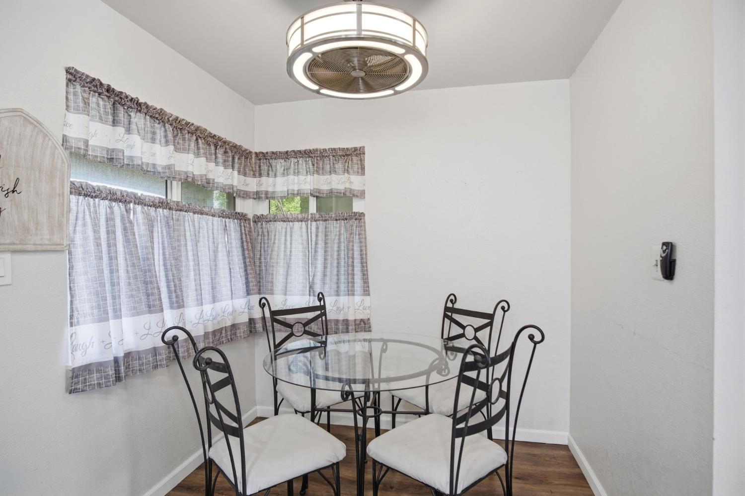 1436 Montclair Drive Modesto, CA 95350 - Photo 17 of 29 a view of a dining room with furniture and chandelier