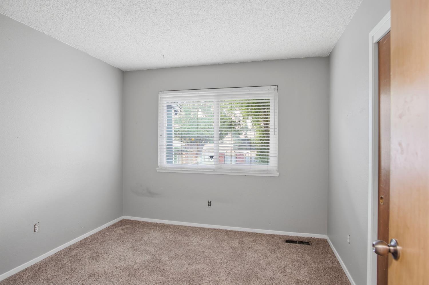 1436 Montclair Drive Modesto, CA 95350 - Photo 20 of 29 an empty room with a window