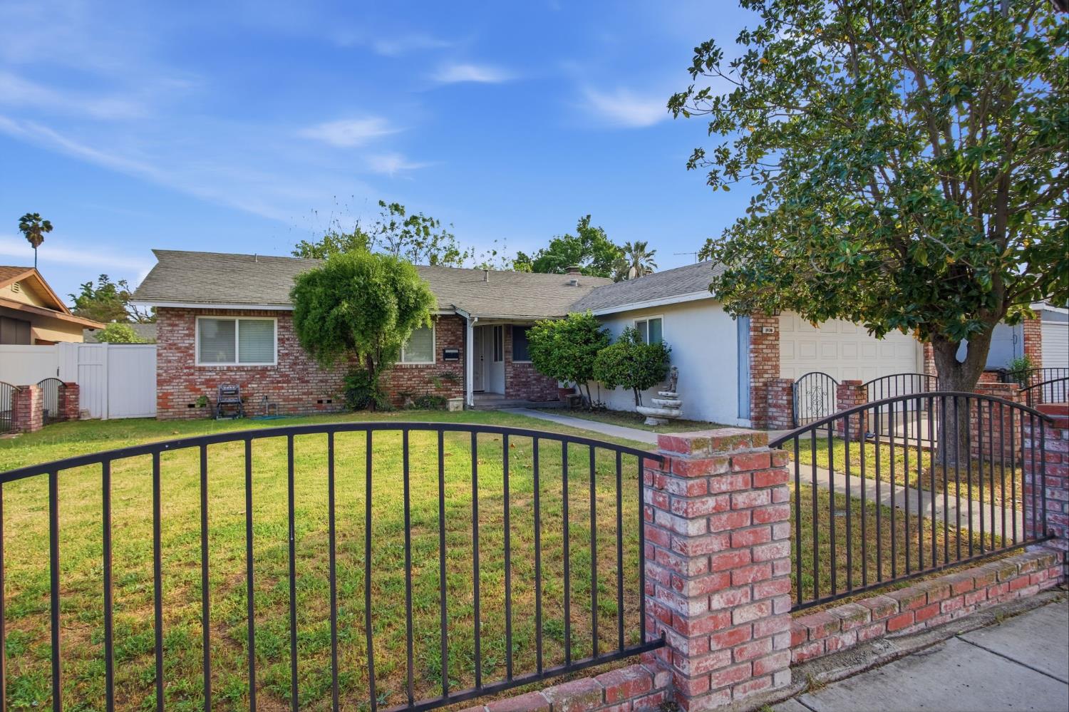1436 Montclair Drive Modesto, CA 95350 - Photo 2 of 29 a view of a house with a swimming pool