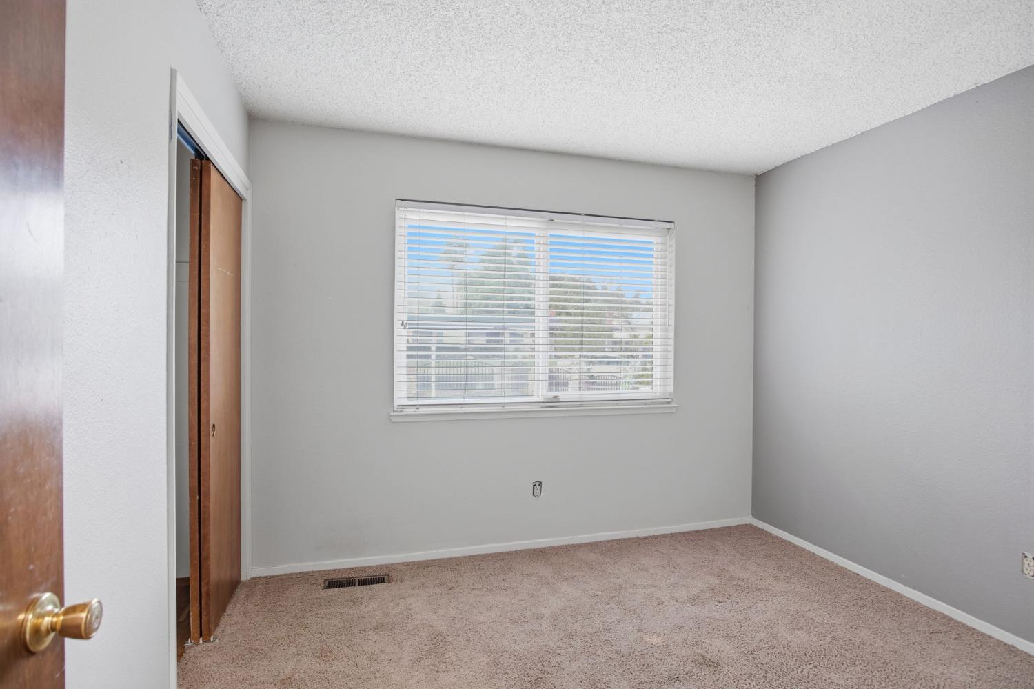 1436 Montclair Drive Modesto, CA 95350 - Photo 21 of 29 an empty room with a window