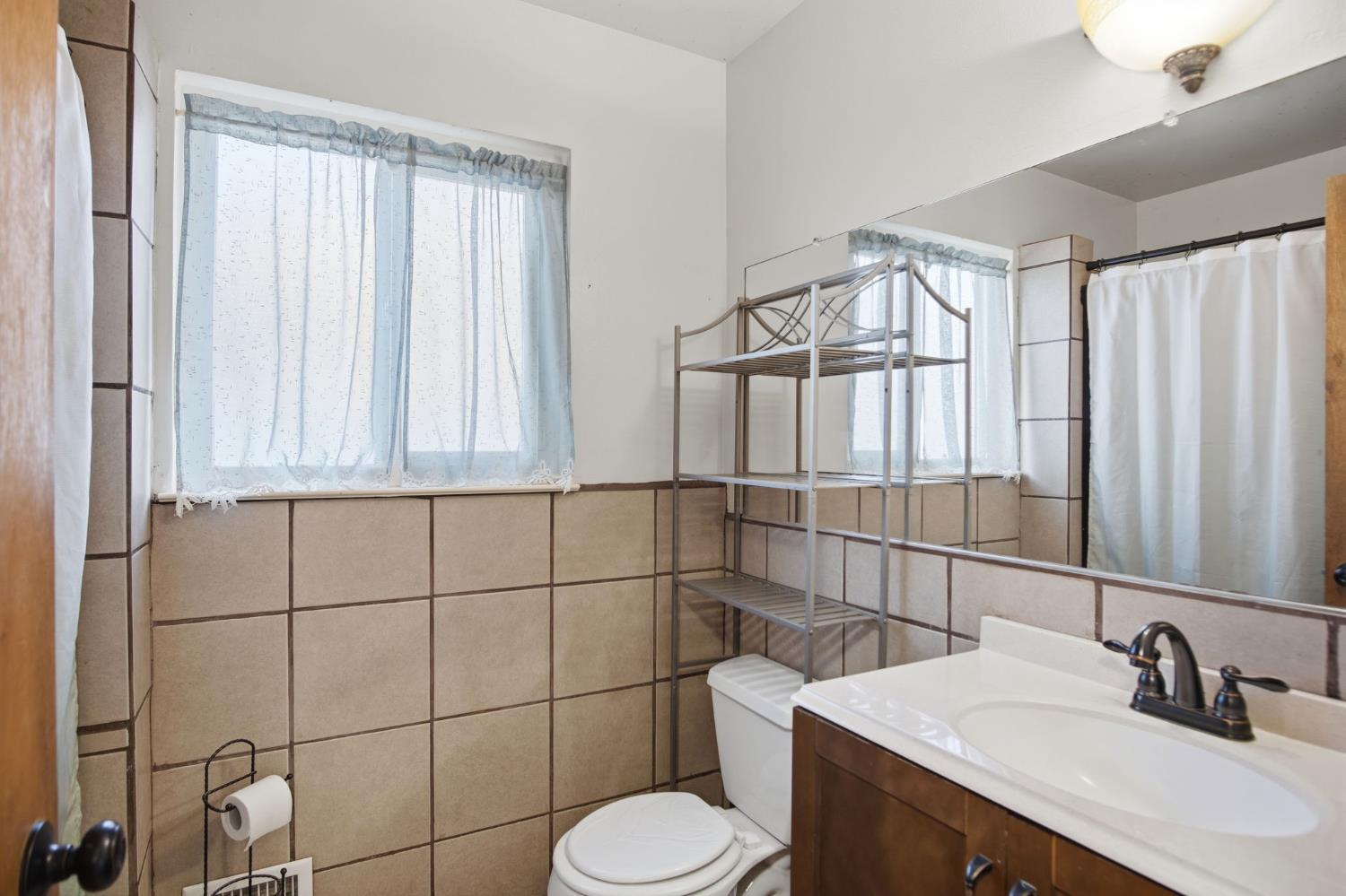 1436 Montclair Drive Modesto, CA 95350 - Photo 22 of 29 a bathroom with a sink toilet and shower