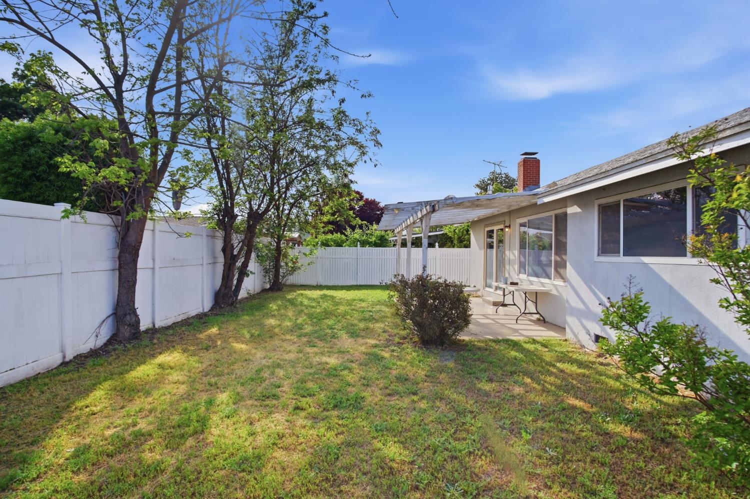 1436 Montclair Drive Modesto, CA 95350 - Photo 27 of 29 a backyard of a house with table and chairs