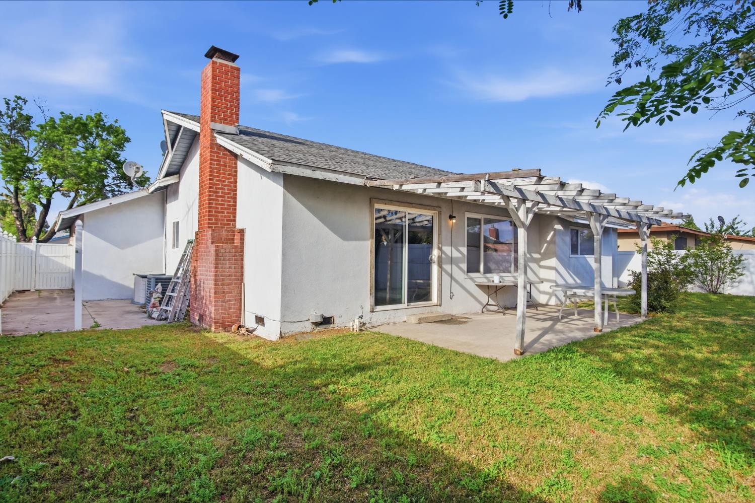 1436 Montclair Drive Modesto, CA 95350 - Photo 29 of 29 a view of a house with a yard and sitting area