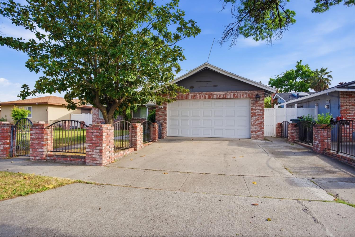 1436 Montclair Drive Modesto, CA 95350 - Photo 3 of 29 front view of a house with a garage