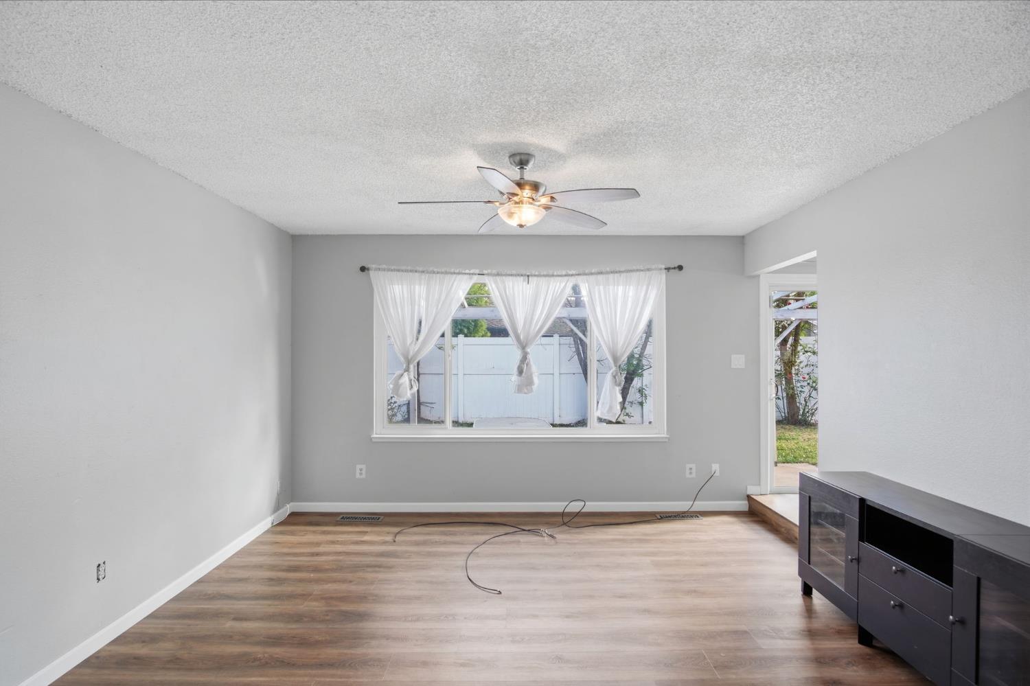 1436 Montclair Drive Modesto, CA 95350 - Photo 6 of 29 wooden floor in an empty room with a window