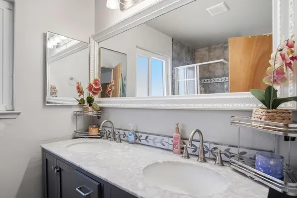 a bathroom with a sink and a mirror