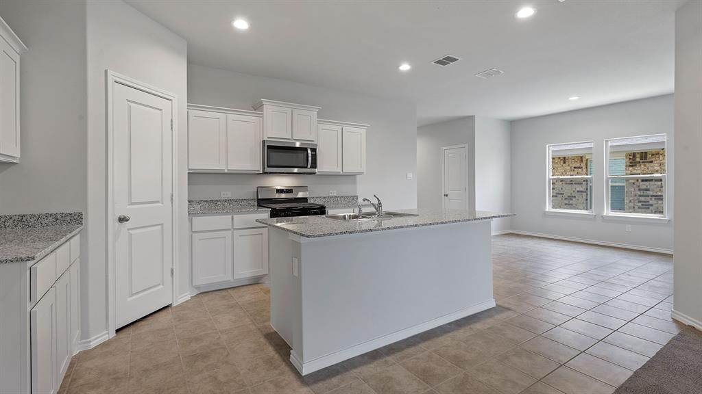 138 Mojave Road Boyd, TX 76023 - Photo 1 of 40 a kitchen with appliances cabinets and a sink