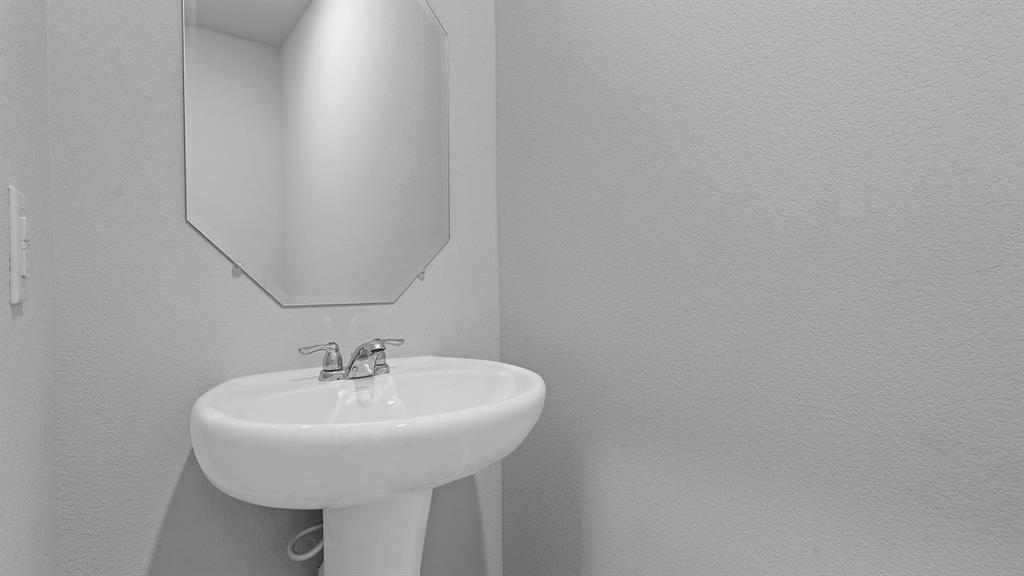 138 Mojave Road Boyd, TX 76023 - Photo 33 of 40 a bathroom with a sink and a mirror