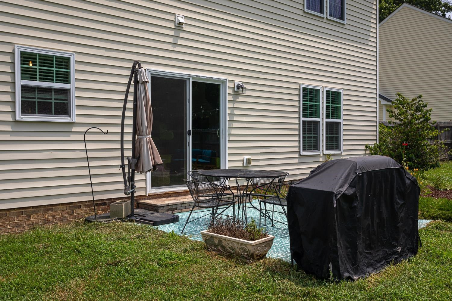 322 Forest Lane Wendell, NC 27591 - Photo 11 of 37 a view of a backyard with a chair and potted plants