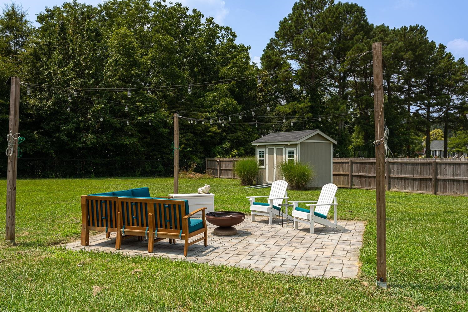 322 Forest Lane Wendell, NC 27591 - Photo 13 of 37 a view of a chair and table in the garden