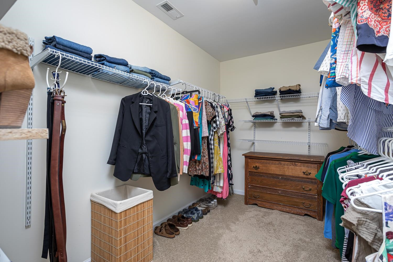 322 Forest Lane Wendell, NC 27591 - Photo 18 of 37 a view of walk in closet with clothes and shoes