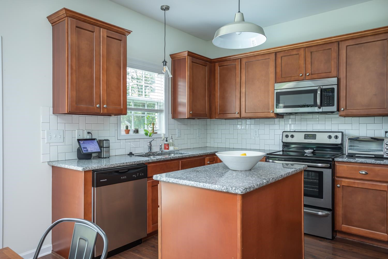 322 Forest Lane Wendell, NC 27591 - Photo 21 of 37 a kitchen with stainless steel appliances granite countertop a stove top oven a sink dishwasher and a microwave oven on the kitchen countertops