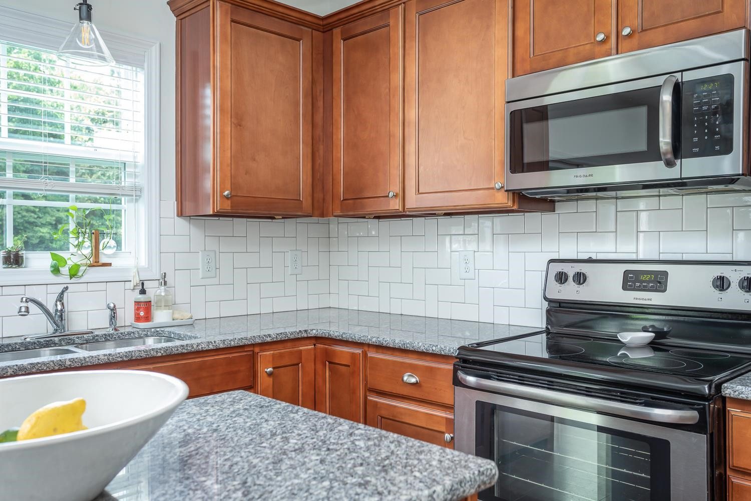 322 Forest Lane Wendell, NC 27591 - Photo 22 of 37 a kitchen with a stove and a sink