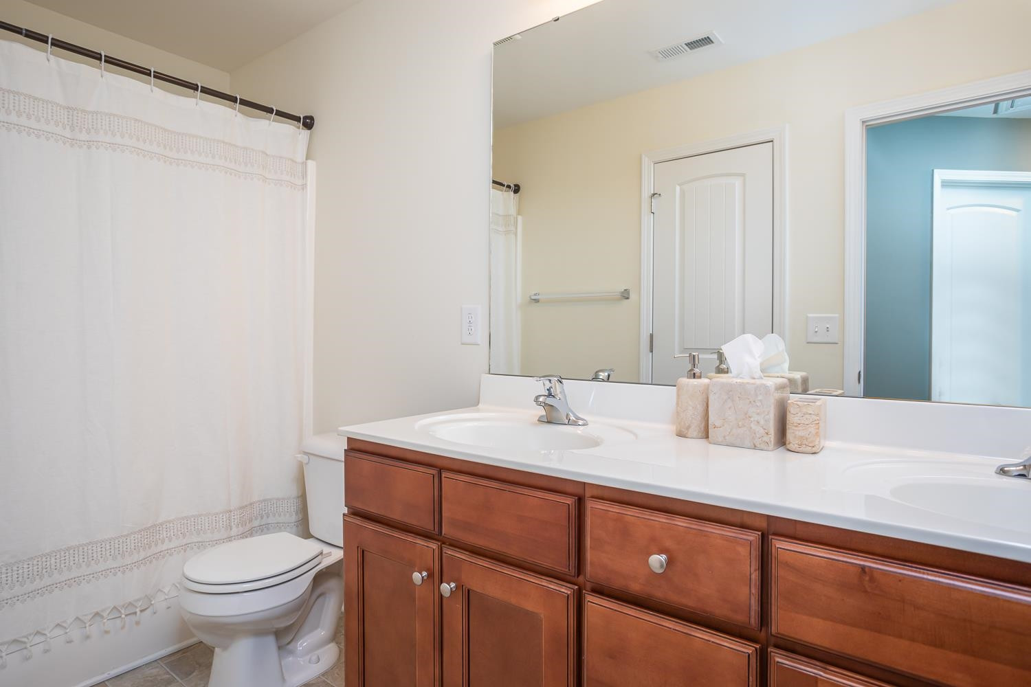 322 Forest Lane Wendell, NC 27591 - Photo 31 of 37 a bathroom with a granite countertop sink toilet and mirror