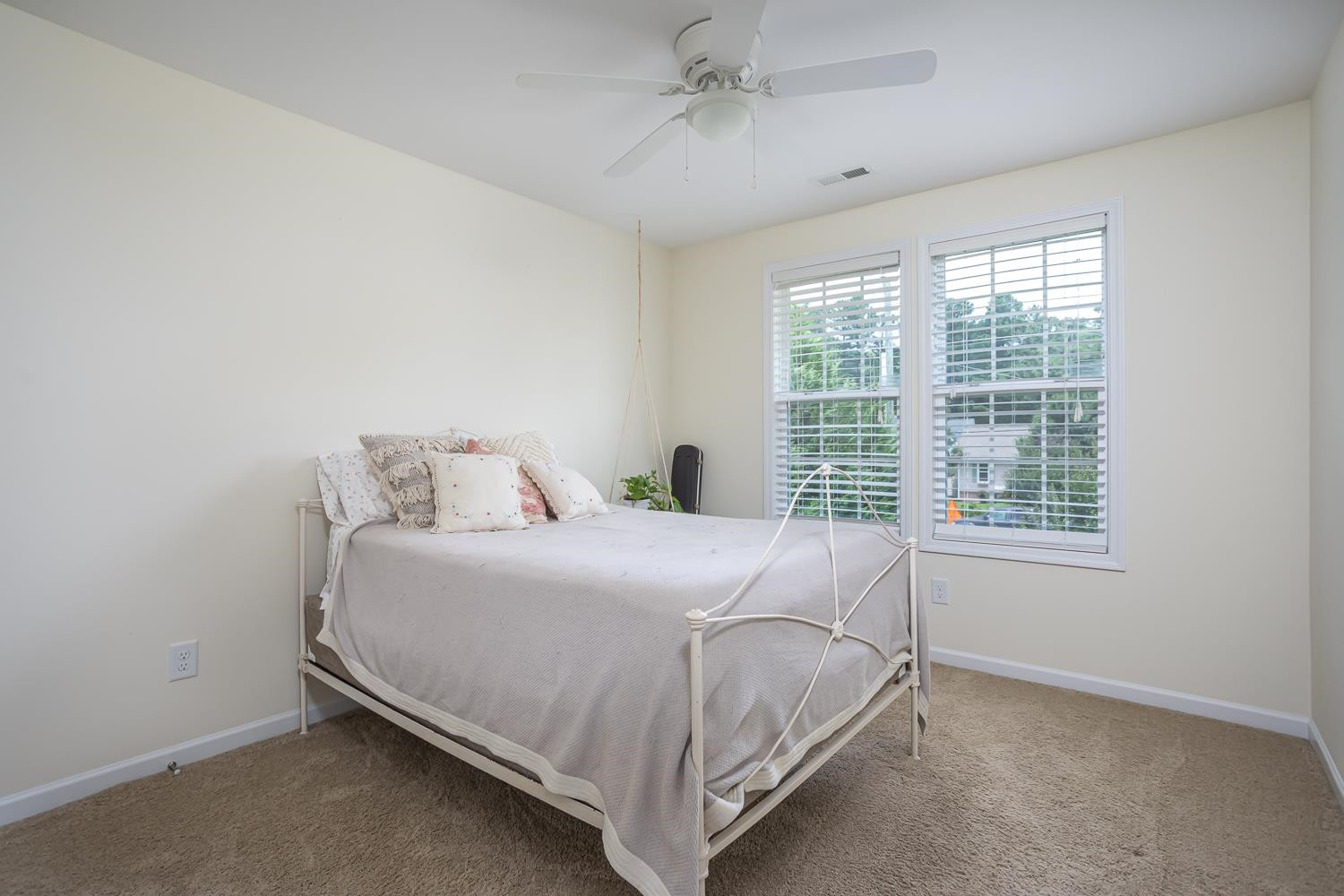 322 Forest Lane Wendell, NC 27591 - Photo 33 of 37 a bed sitting in a bedroom next to a window