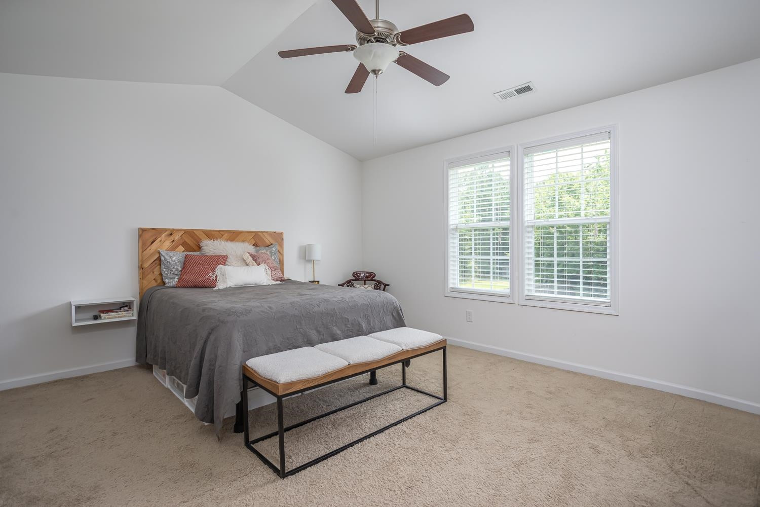 322 Forest Lane Wendell, NC 27591 - Photo 34 of 37 a bed sitting in a bedroom next to a window