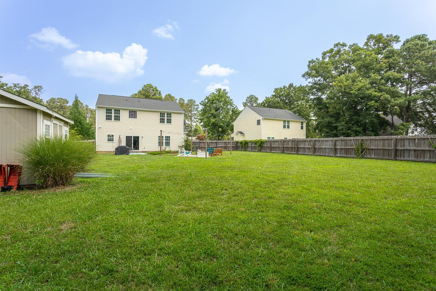 322 Forest Lane Wendell, NC 27591 - Photo 7 of 37 a view of a house with a big yard and palm trees