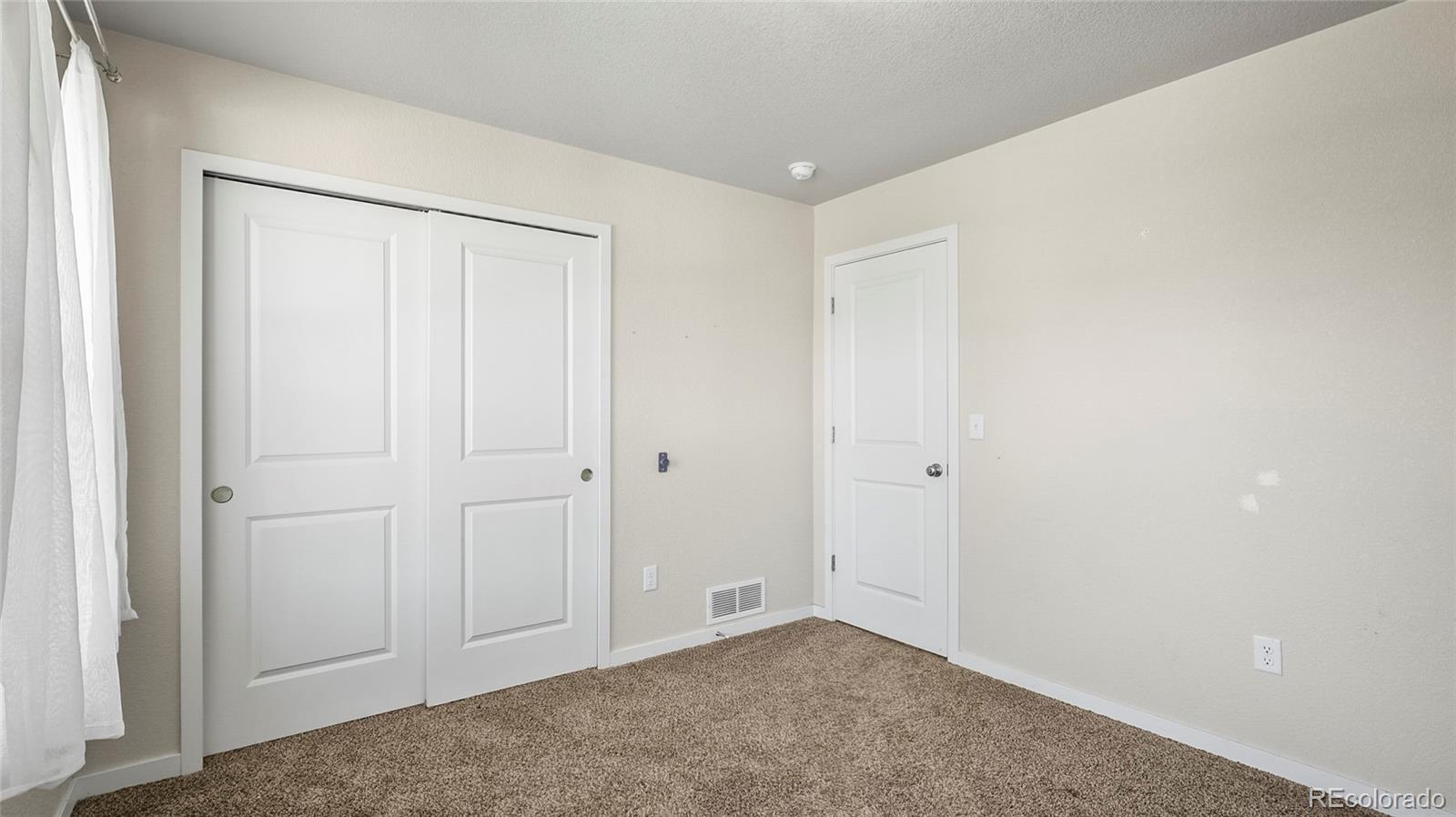 1106 Johnson Street Wiggins, CO 80654 - Photo 12 of 22 a view of an empty room