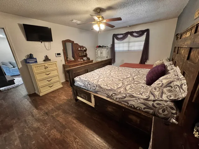 a bathroom with a toilet and a mirror