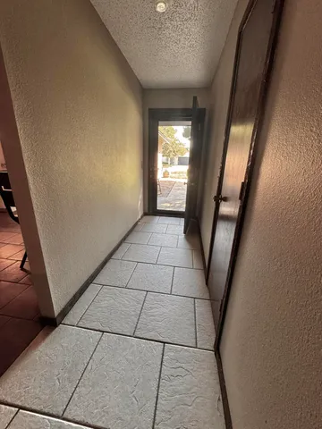 a view of entryway with stairs and a window