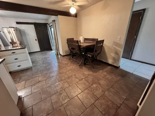 a view of a hallway with seating area