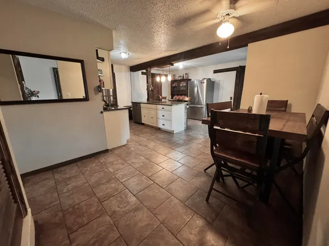 a kitchen with stainless steel appliances a refrigerator and a stove