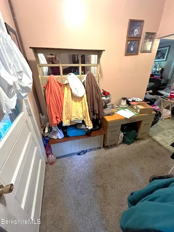 a bedroom with furniture and a couch