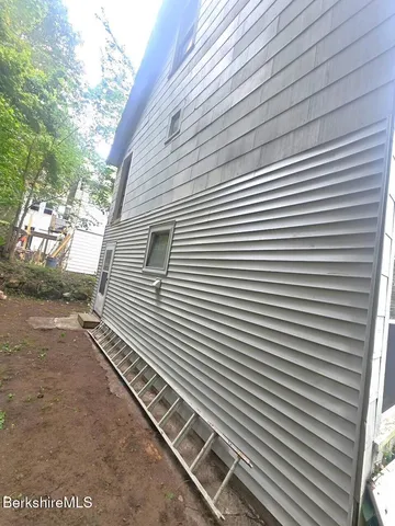 a view of a backyard with a door