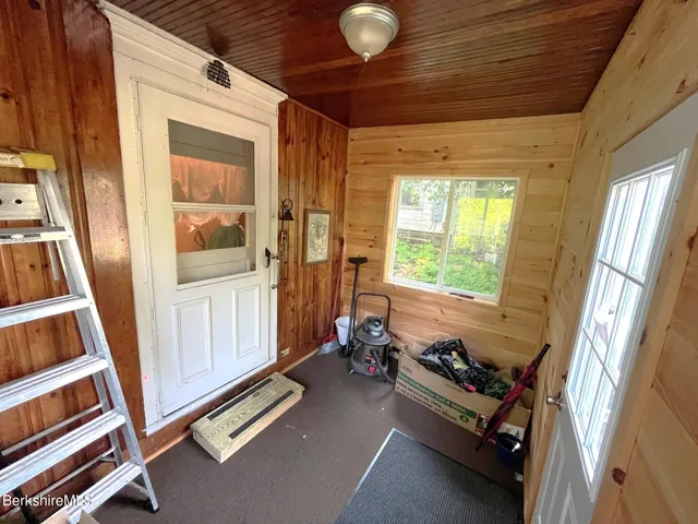 a room with wooden floor and furniture