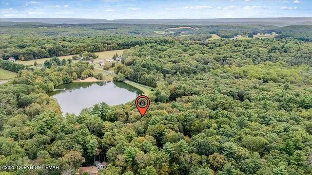 an aerial view of a houses with outdoor space and street view