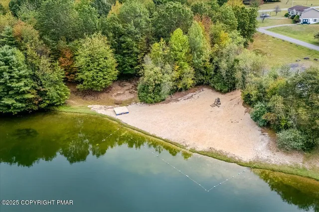 a view of a lake with a yard