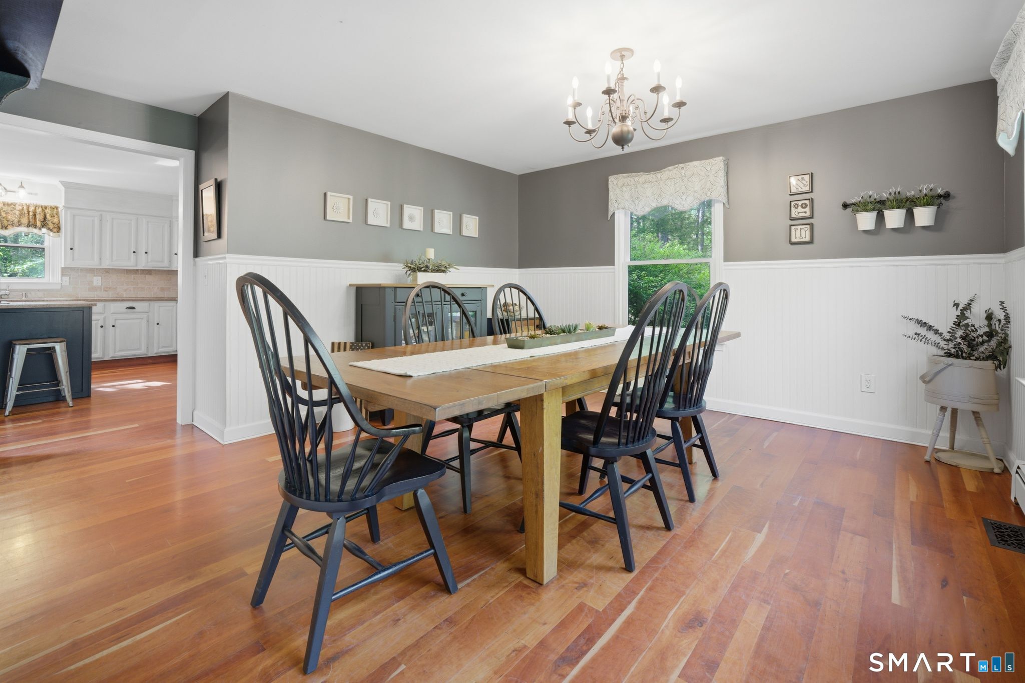 174 Walnut Hill Road Hartland, CT 06027 - Photo 8 of 36 a dining room with furniture and wooden floor