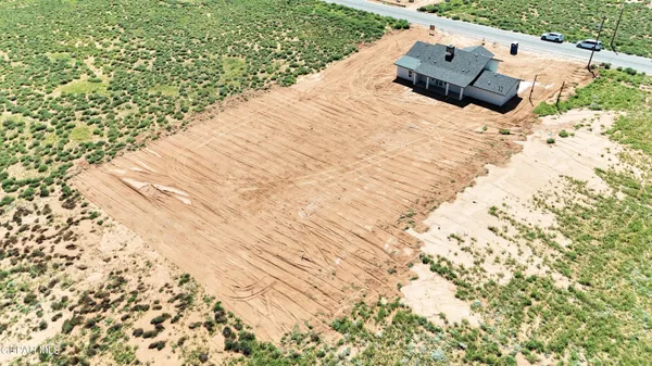 a bed sitting in a bedroom next to a yard