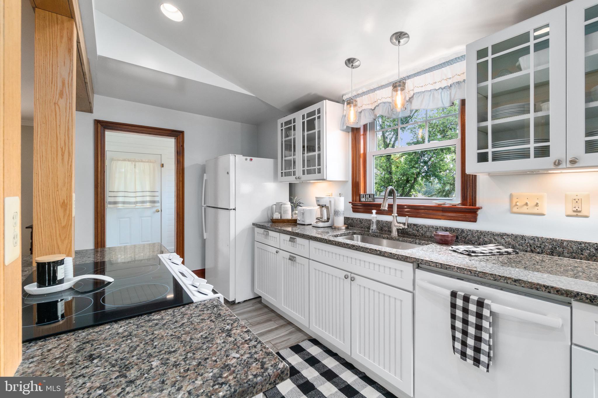 2017 Drummond Road Baltimore, MD 21228 - Photo 30 of 50 Cook top island + some glass front cabinets