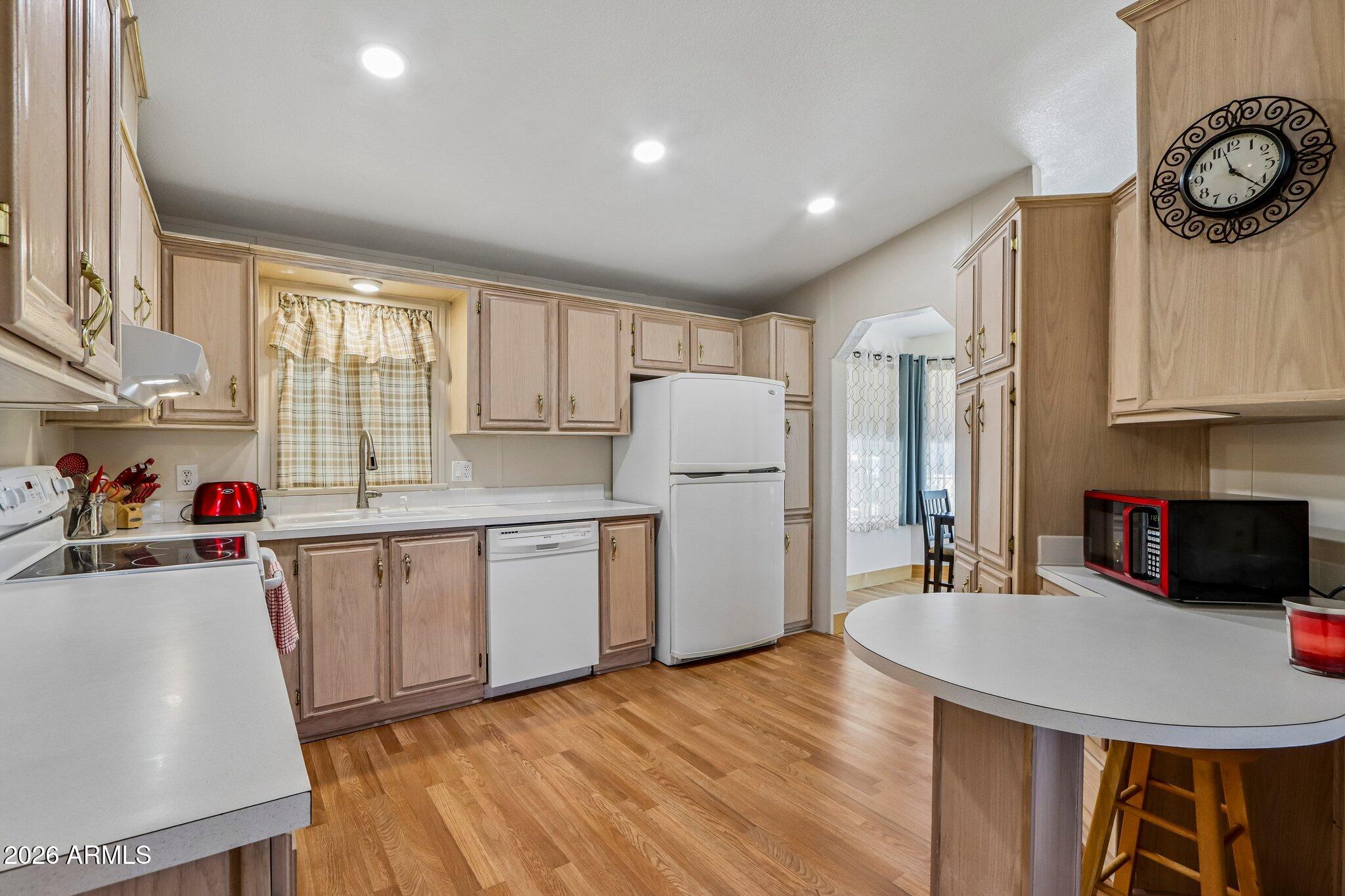 114 South Pinecrest Road Payson, AZ 85541 - Photo 10 of 40 a kitchen with refrigerator cabinets and a sink