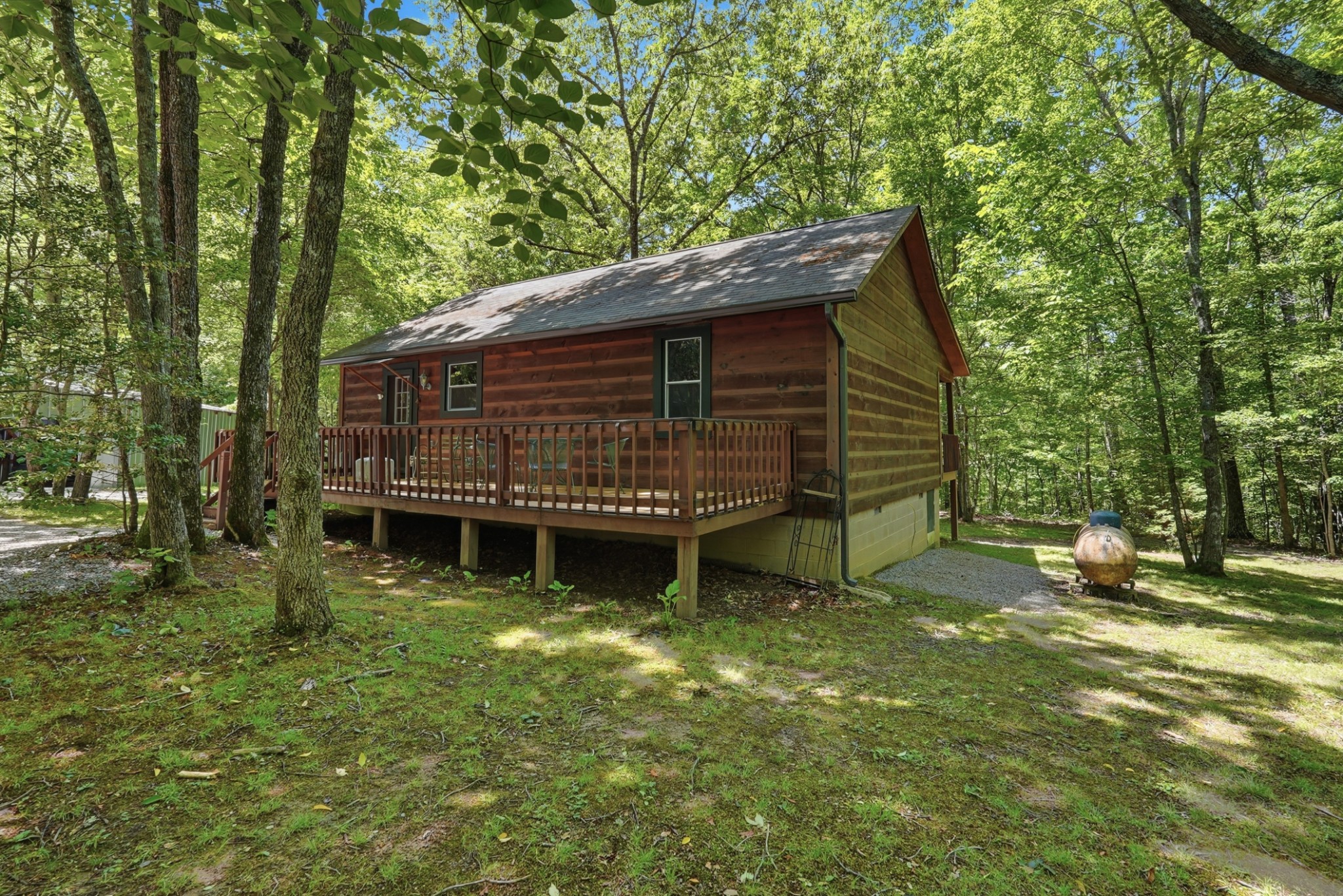 118 Cherokee Road Spencer, TN 38585 - Photo 22 of 85 a backyard of a house with lots of green space
