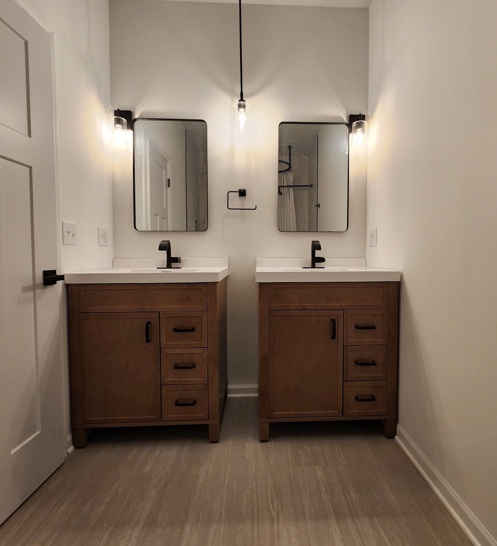 422 View Street Ottawa, IL 61350 - Photo 9 of 22 a bathroom with a double vanity sink and mirror