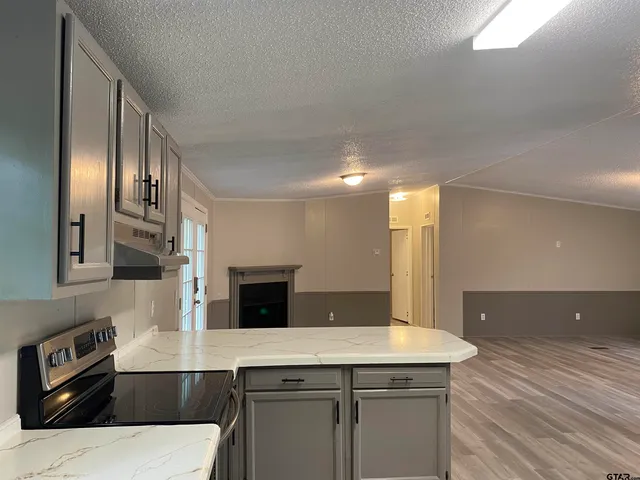 a kitchen with a sink and refrigerator