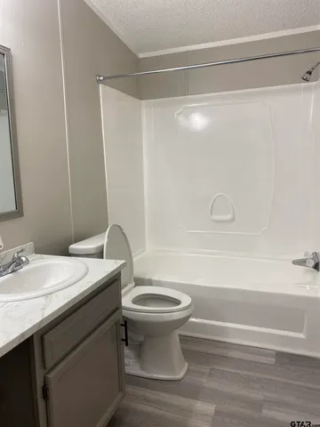 a bathroom with a sink a toilet and a bathtub