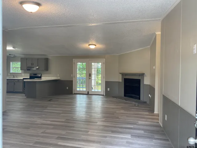 a view of kitchen with cabinets and wooden floor