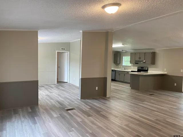 a view of kitchen with wooden floor