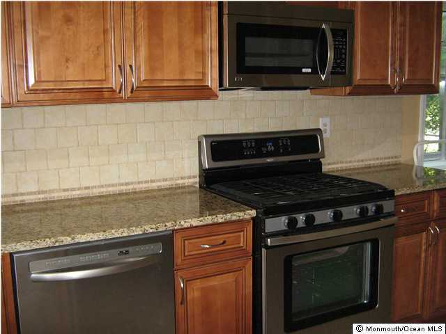 28 Albany Road Neptune Township, NJ 07753 - Photo 3 of 3 a stove top oven sitting inside of a kitchen